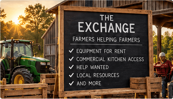 A large chalkboard sign in a barn yard at sunrise reading "The Exchange — farmers helping farmers", listing equipment for rent, commercial kitchen access, help wanted, local resources and more. A green tractor and stacked wooden crates stand beside it.